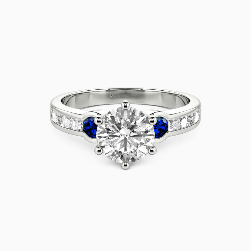 "Seal Your Vows" Round Cut Side Stone Engagement Ring