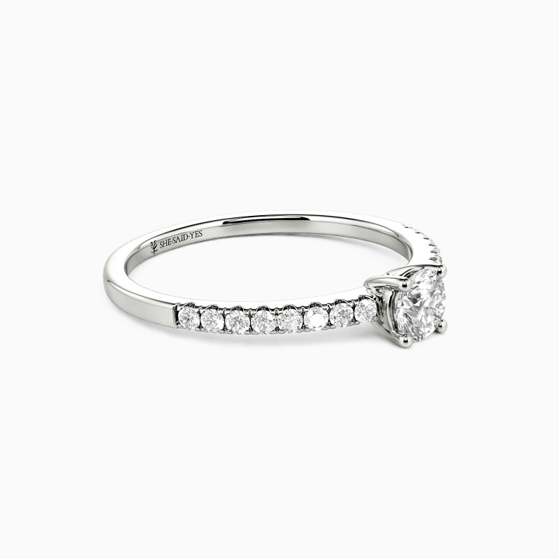 "Love is Light" 0.3ct Round Cut Side Stone Engagement Ring