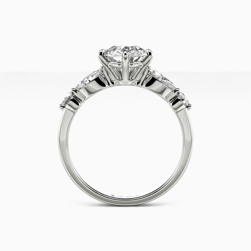 "The Portrait of Love" Pear Cut Side Stone Engagement Ring