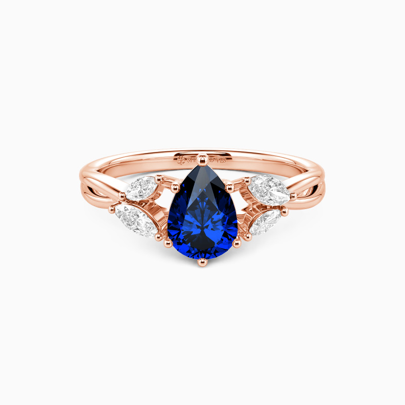 "Sun Glint" 0.8ct Pear Cut Side Stone Engagement Ring