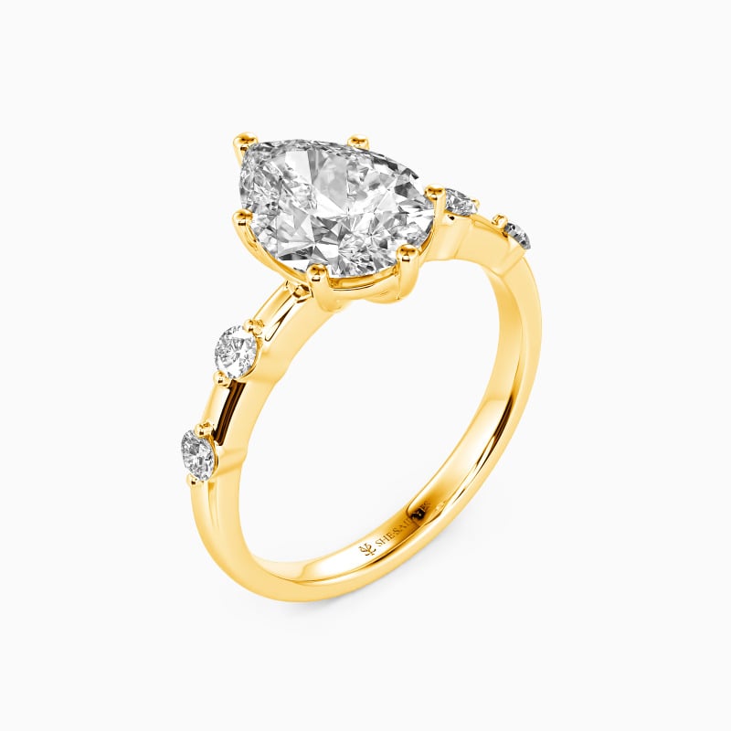 "Satellite Of Love" Pear Cut Side Stone Engagement Ring