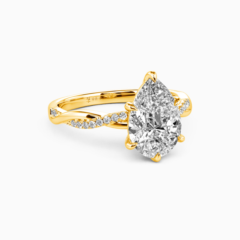 "Word of Honor" Pear Cut Side Stone Engagement Ring