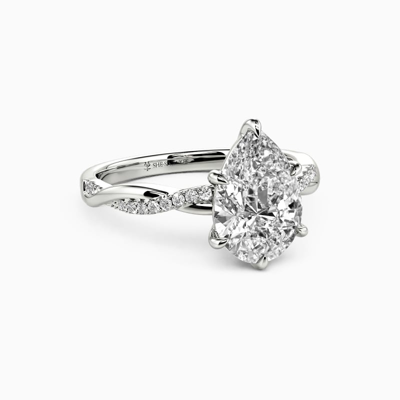 "Word of Honor" Pear Cut Side Stone Engagement Ring