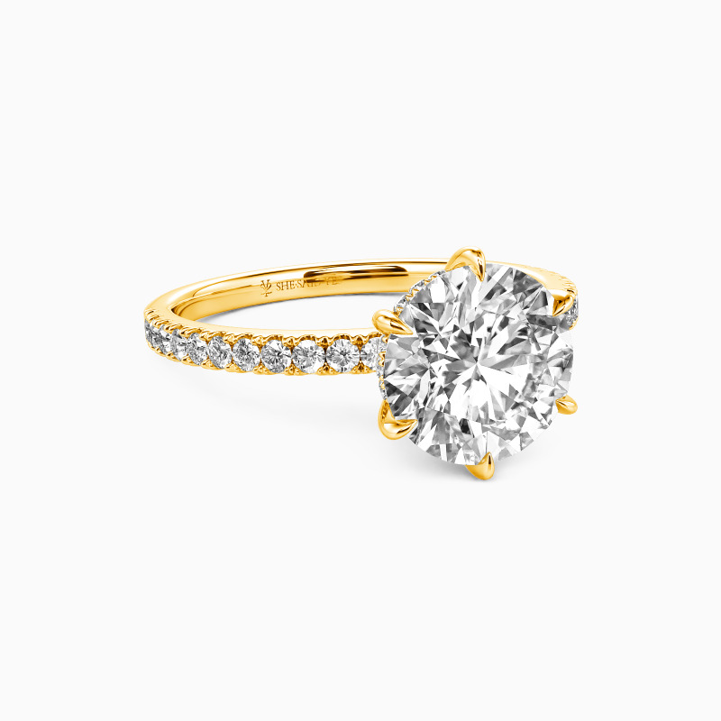 "In The Name Of Love" Round Cut Side Stone Engagement Ring