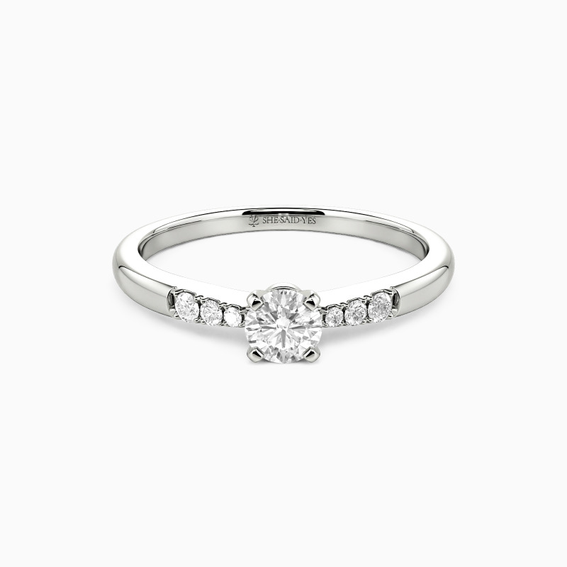 "This Magic Moment" 0.3ct Round Cut Side Stone Engagement Ring