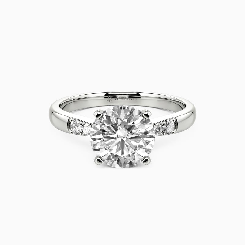 "This Magic Moment" Round Cut Side Stone Engagement Ring