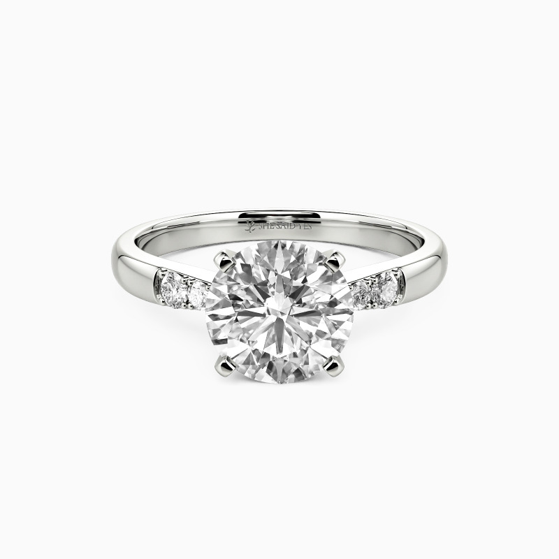 "This Magic Moment" 1.5ct Round Cut Side Stone Engagement Ring
