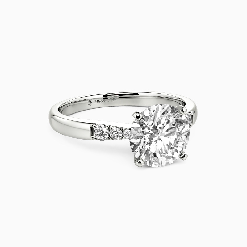 "This Magic Moment" Round Cut Side Stone Engagement Ring