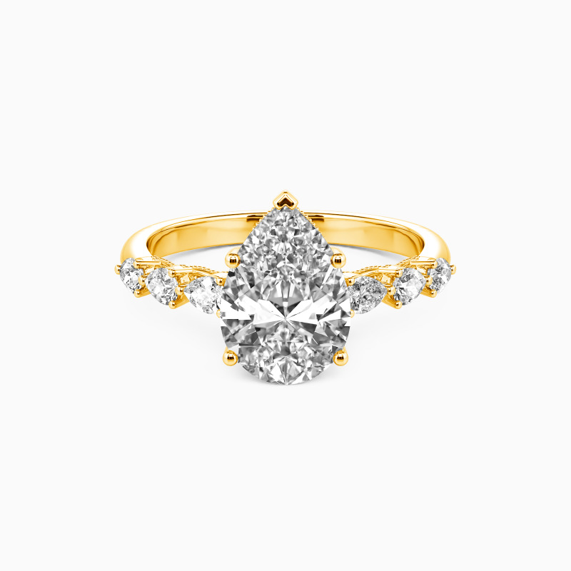 "A Tear-drop of Love" Pear Cut Side Stone Engagement Ring