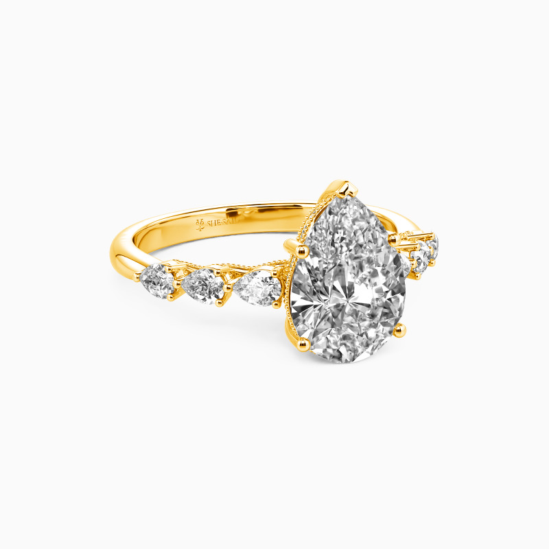 "A Tear-drop of Love" Pear Cut Side Stone Engagement Ring