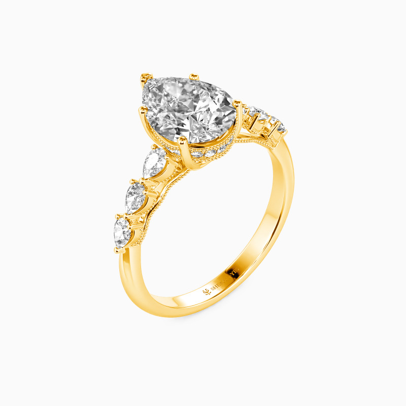 "A Tear-drop of Love" Pear Cut Side Stone Engagement Ring