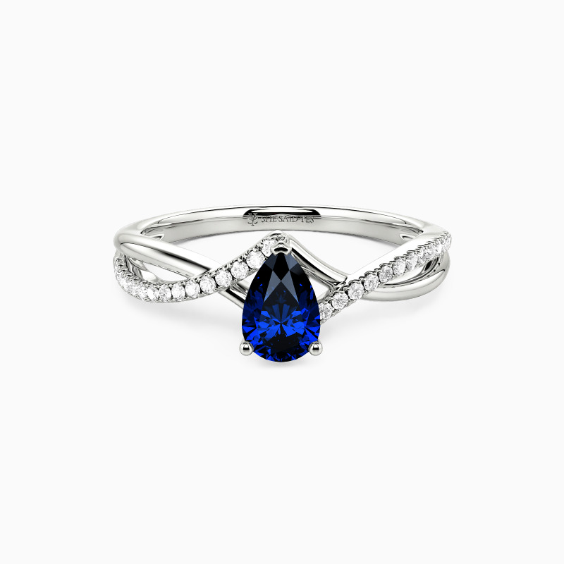 "Falling Slowly" 0.5ct Pear Cut Side Stone Engagement Ring