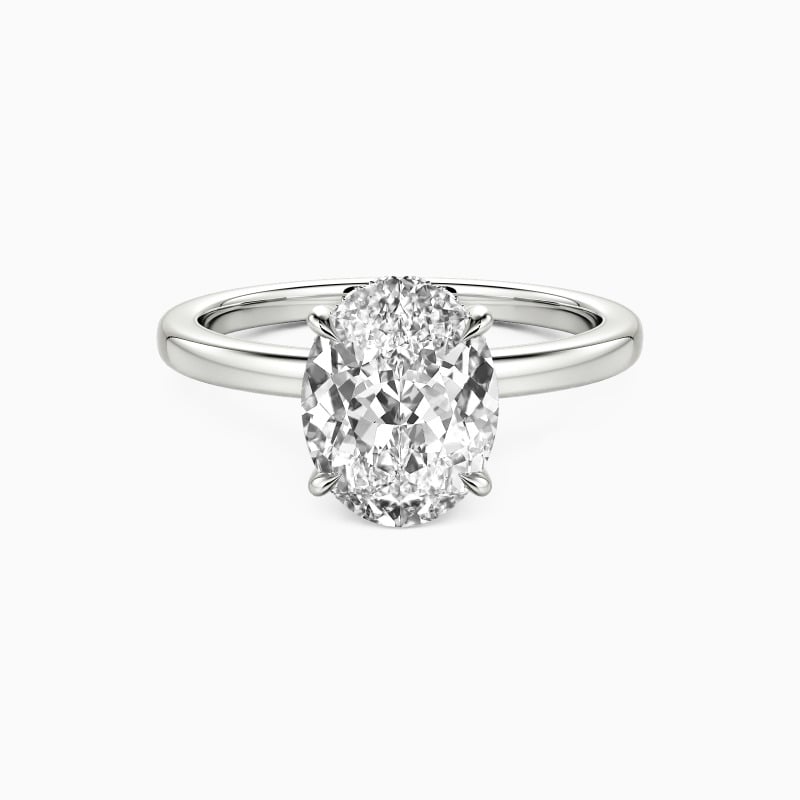 "A Statement of Faith" Oval Cut Side Stone Engagement Ring