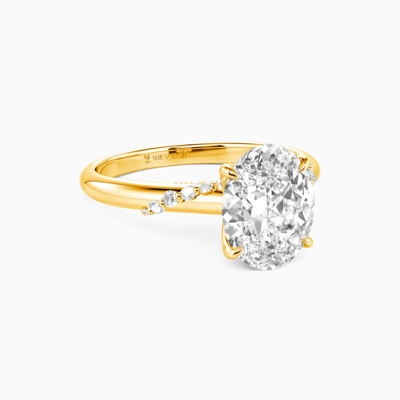 "Romantic Reverie" Oval Cut Side Stone Engagement Ring