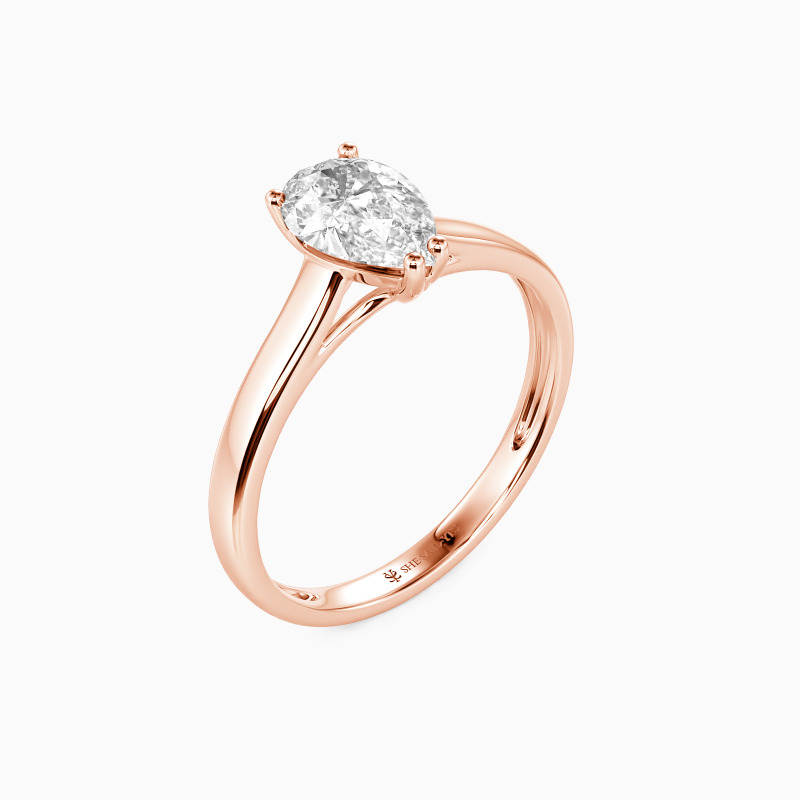 "Love Story" 0.8ct Pear Cut Solitaire Engagement Ring