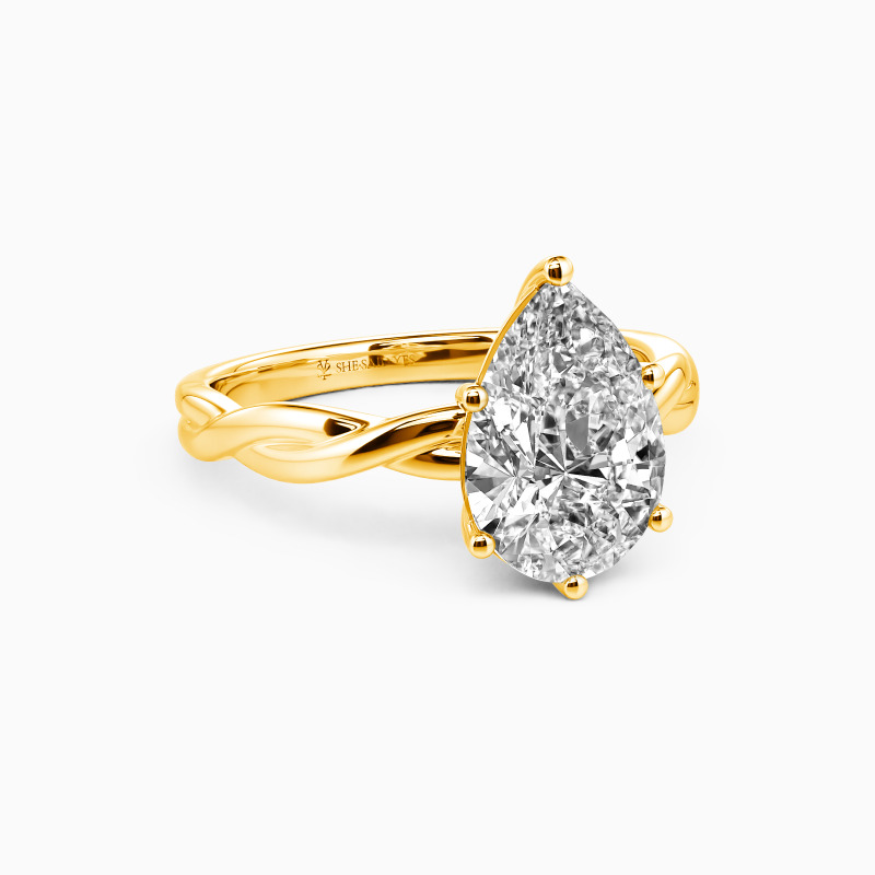 "Anything For Her" Pear Cut Solitaire Engagement Ring