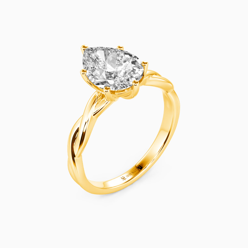 "Anything For Her" Pear Cut Solitaire Engagement Ring