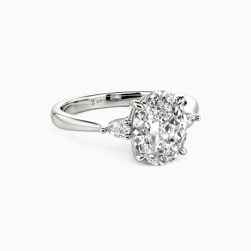 "The Beginning Of Love" Oval Cut Three Stone Engagement Ring