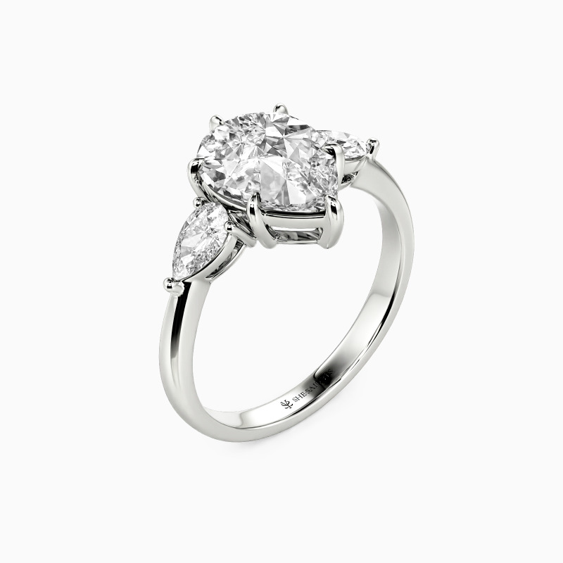 "Never-ending Story" Pear Cut Three Stone Engagement Ring