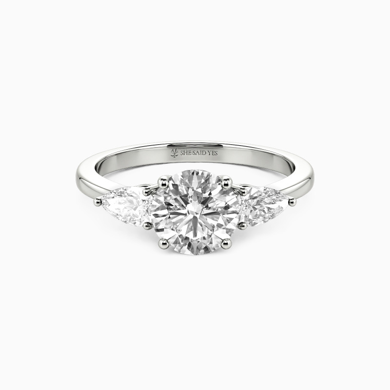 "The Beginning" Round Cut Three Stone Engagement Ring