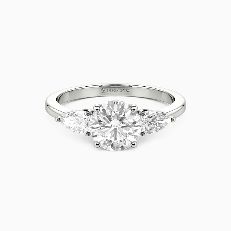 "The Beginning" Round Cut Three Stone Engagement Ring