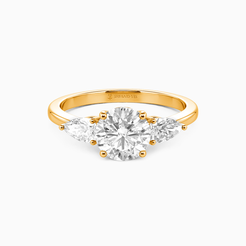 "The Beginning" Round Cut Three Stone Engagement Ring