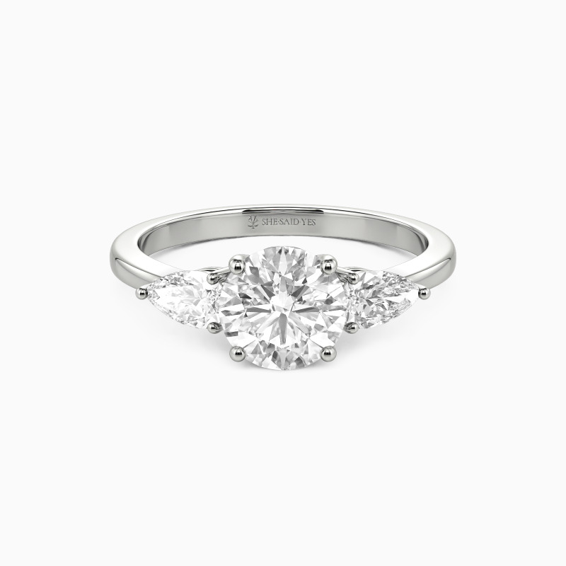 "The Beginning" Round Cut Three Stone Engagement Ring