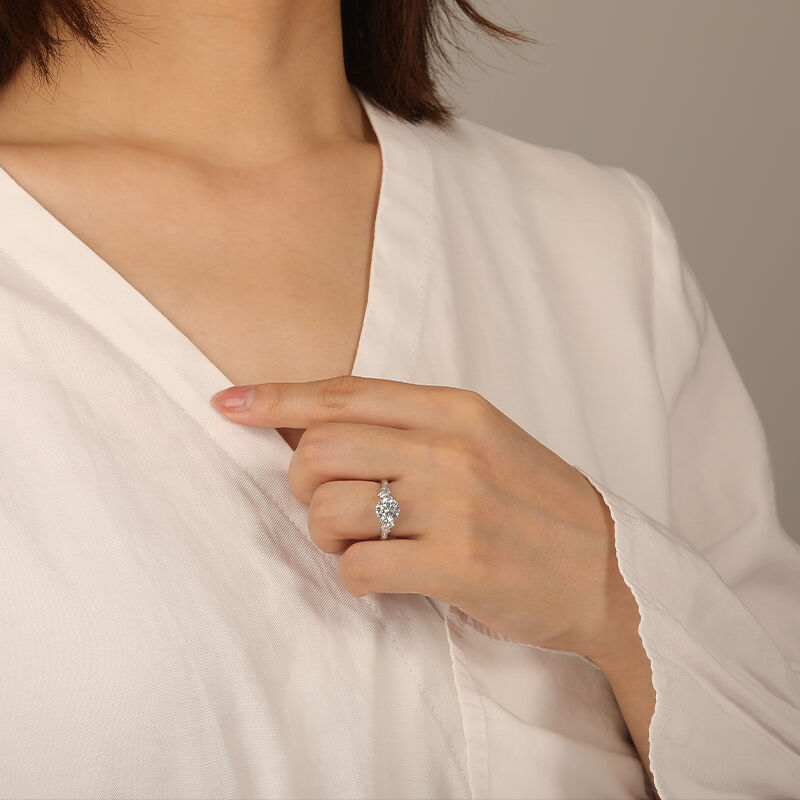 "Stay by Your Side" Round Cut Side Stone Engagement Ring
