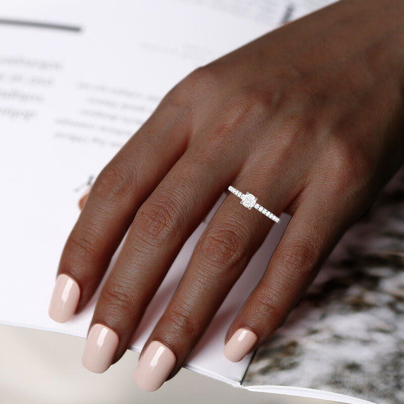 "Love is Light" 0.3ct Round Cut Side Stone Engagement Ring