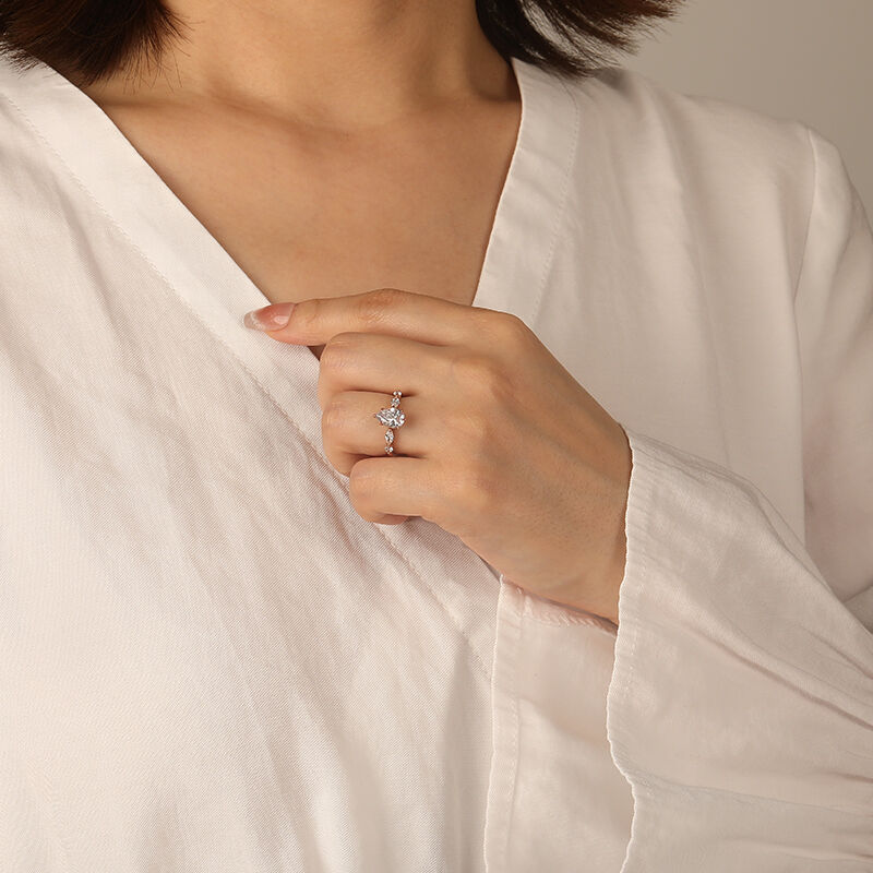 "The Portrait of Love" 1.5ct Pear Cut Side Stone Engagement Ring