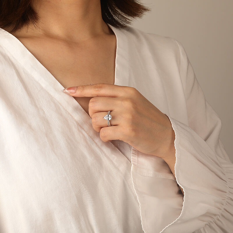 "Just Us" Pear Cut Side Stone Engagement Ring