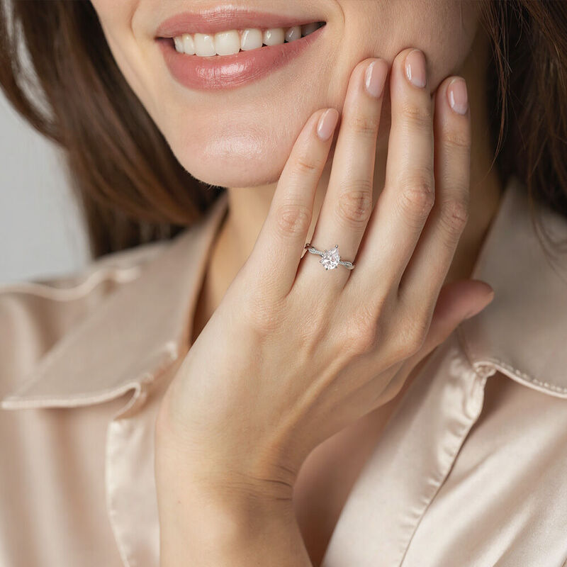 "Word of Honor" Pear Cut Side Stone Engagement Ring