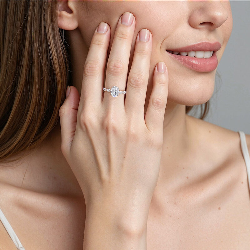 "You Got Me" Oval Cut Side Stone Engagement Ring