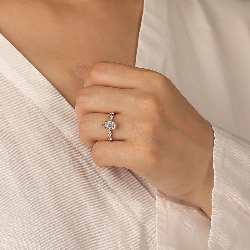 "The Portrait of Love" 1.5ct Pear Cut Side Stone Engagement Ring